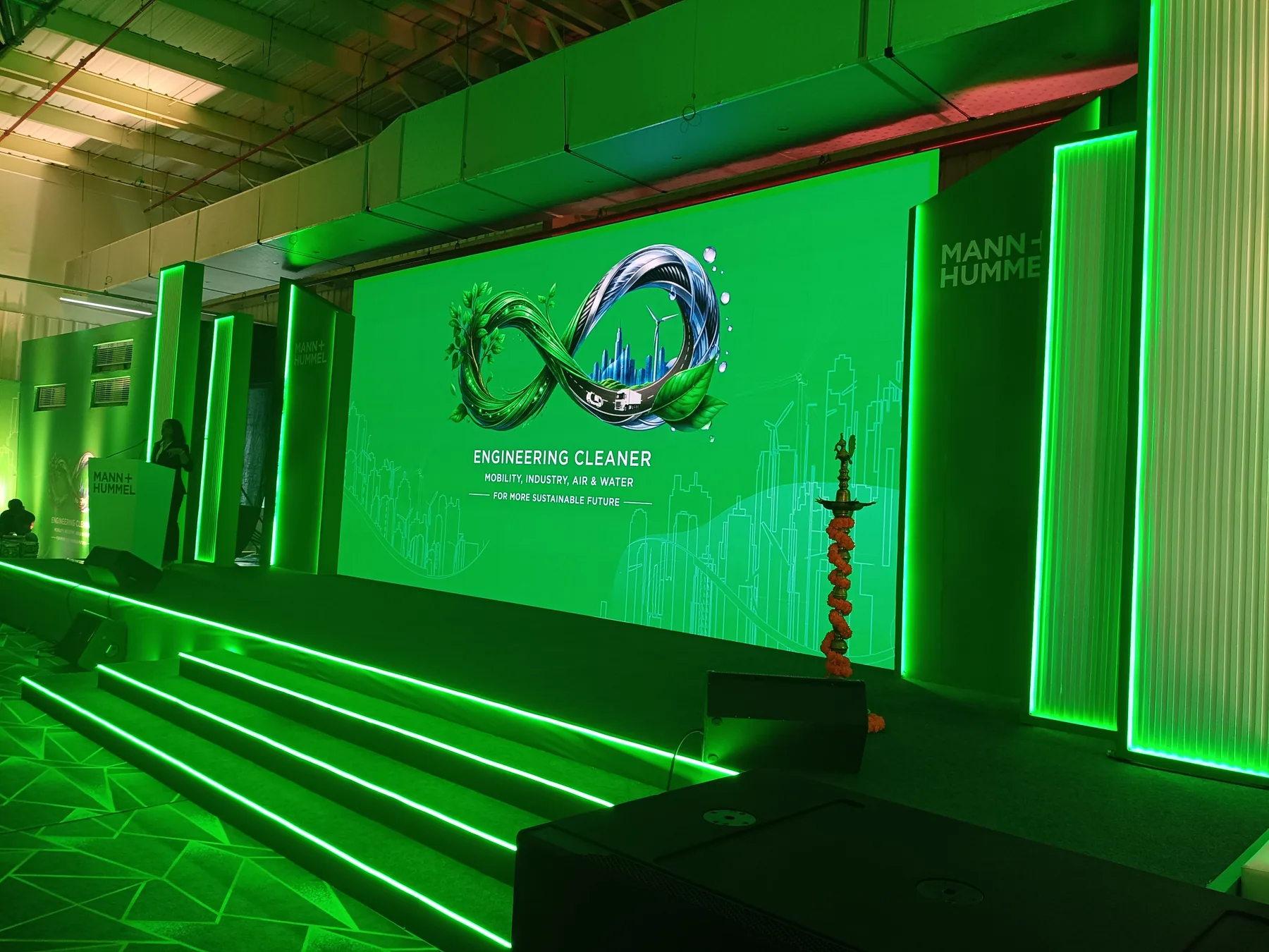 Green-lit stage and display screen