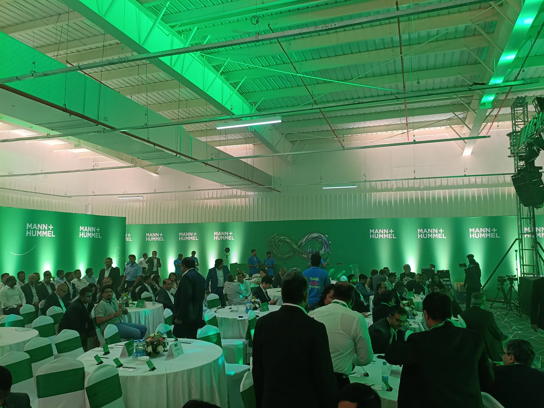 Audience seating beneath overhead event lighting
