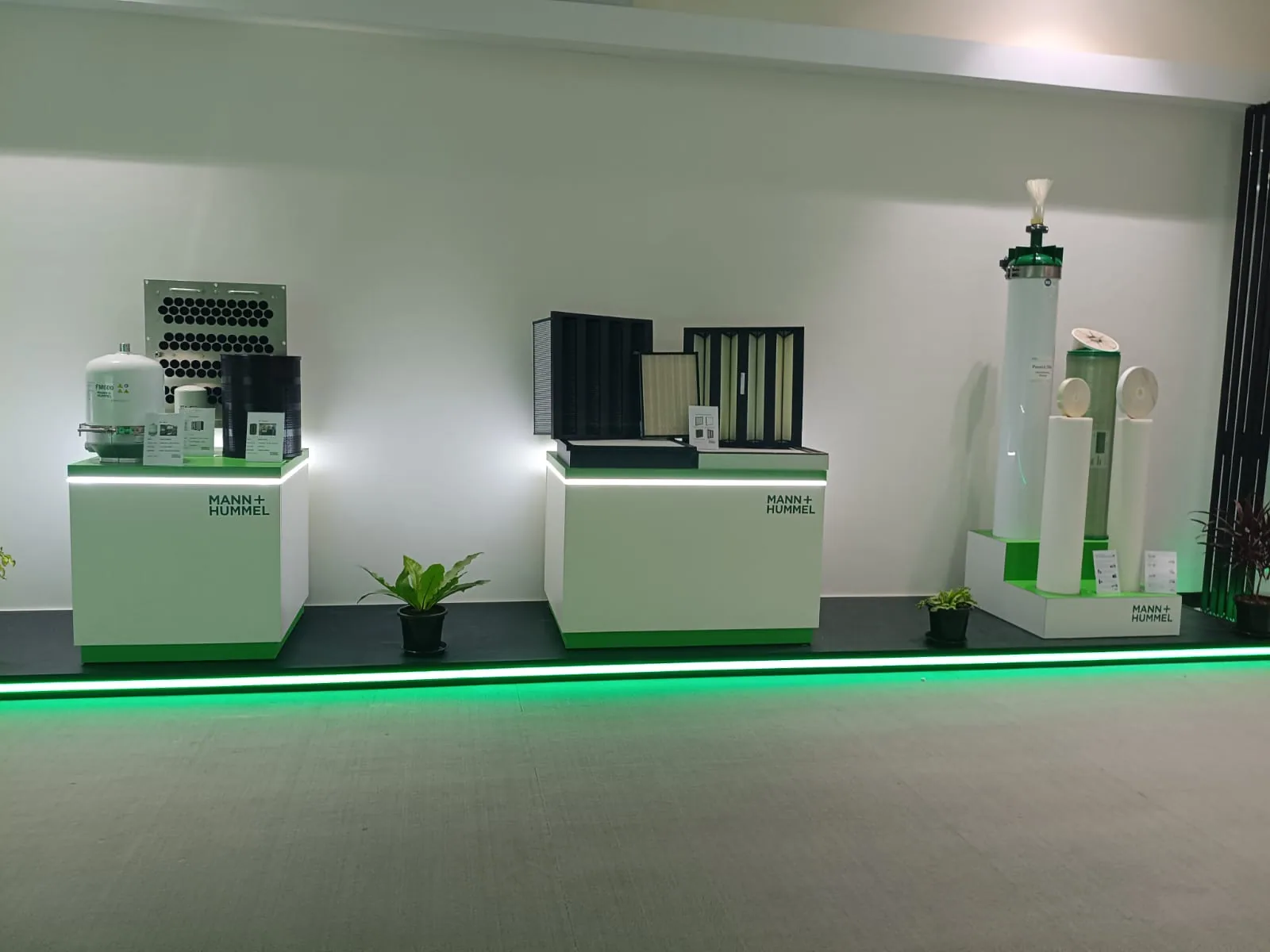 Product plinths and the green light strip along the floor