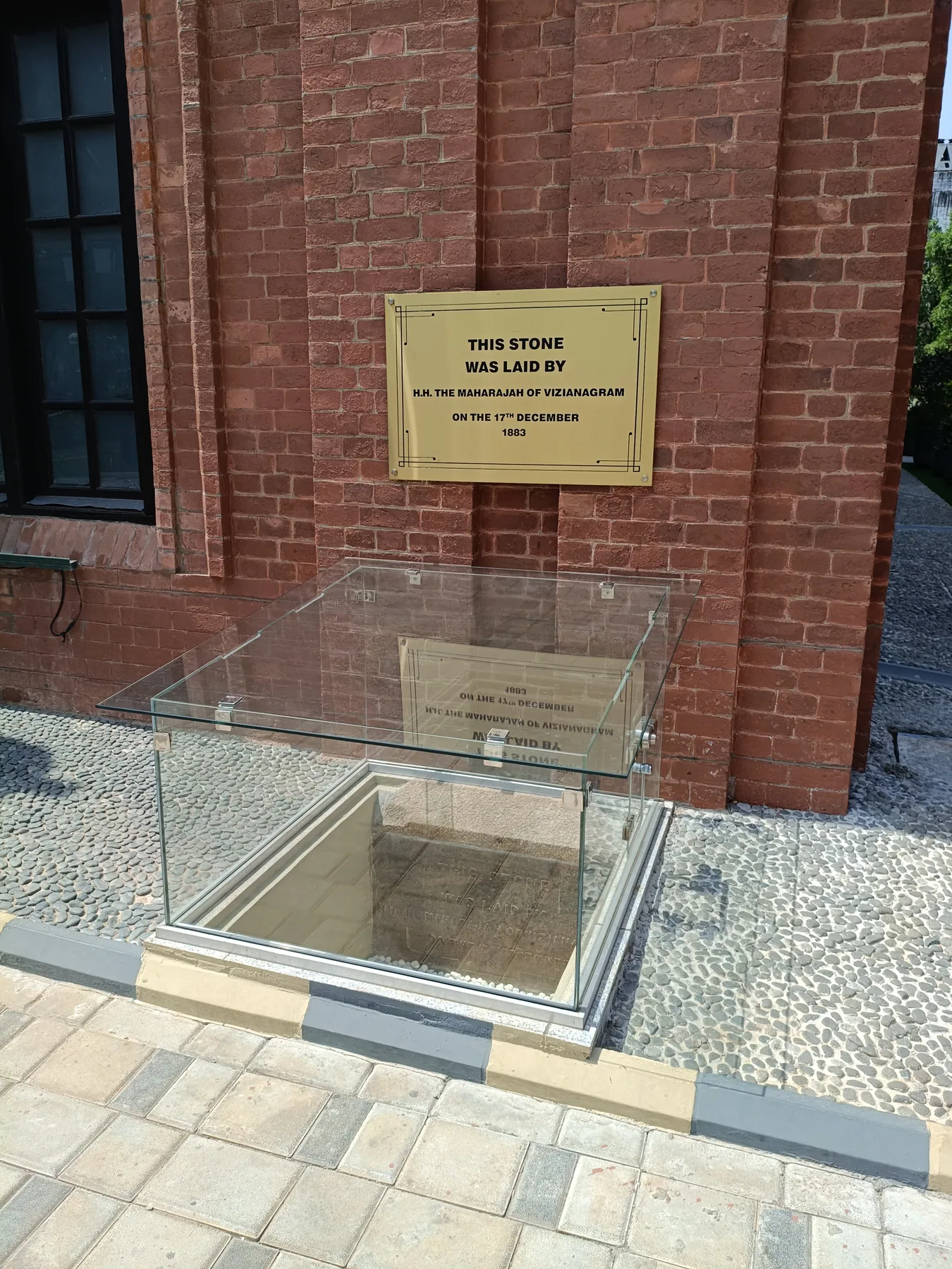 Second view of the glass-covered entrance plaque