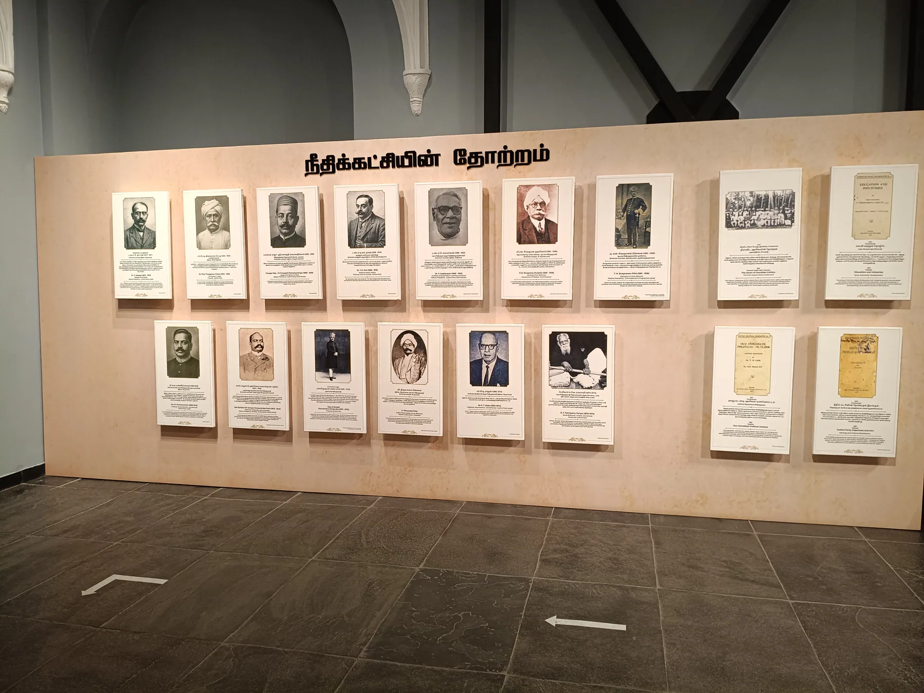 Portrait and text panels on a freestanding exhibition wall