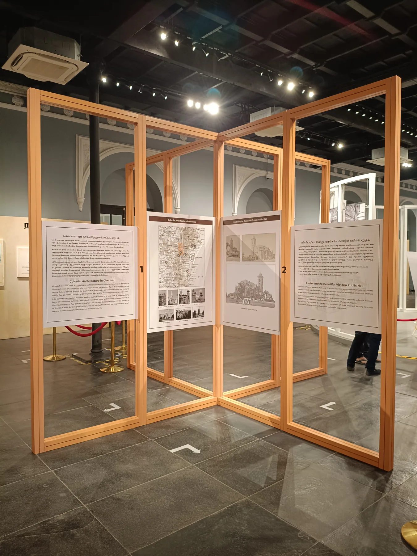 Timber-framed display beside the white circular structure