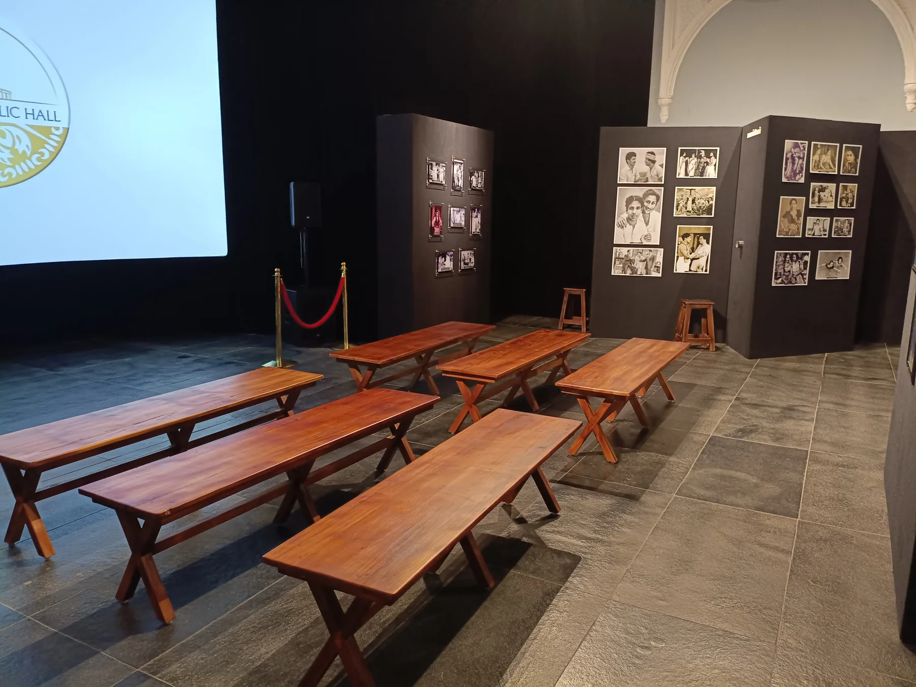 Benches facing a curved projection screen