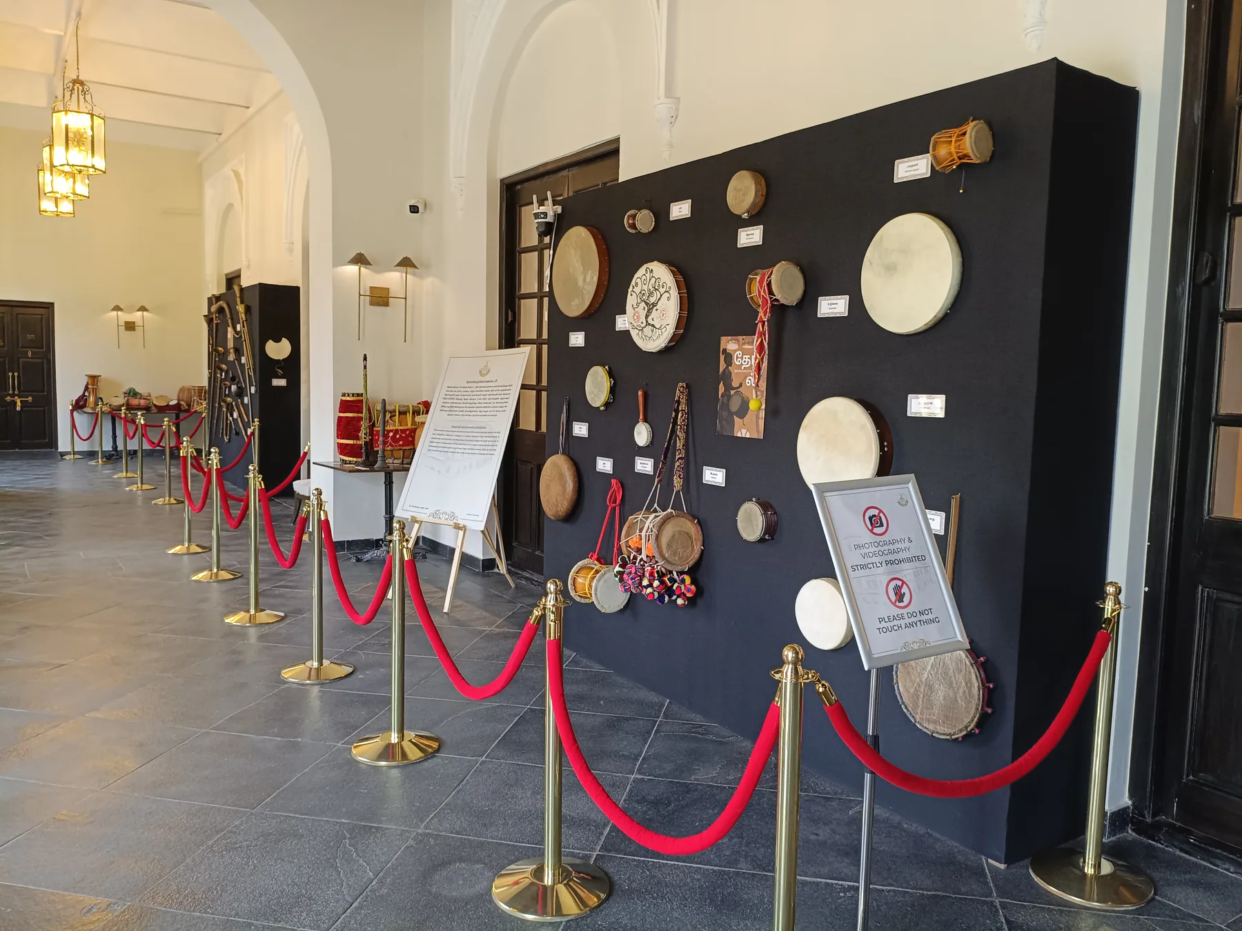 Circular objects mounted on a dark exhibit panel